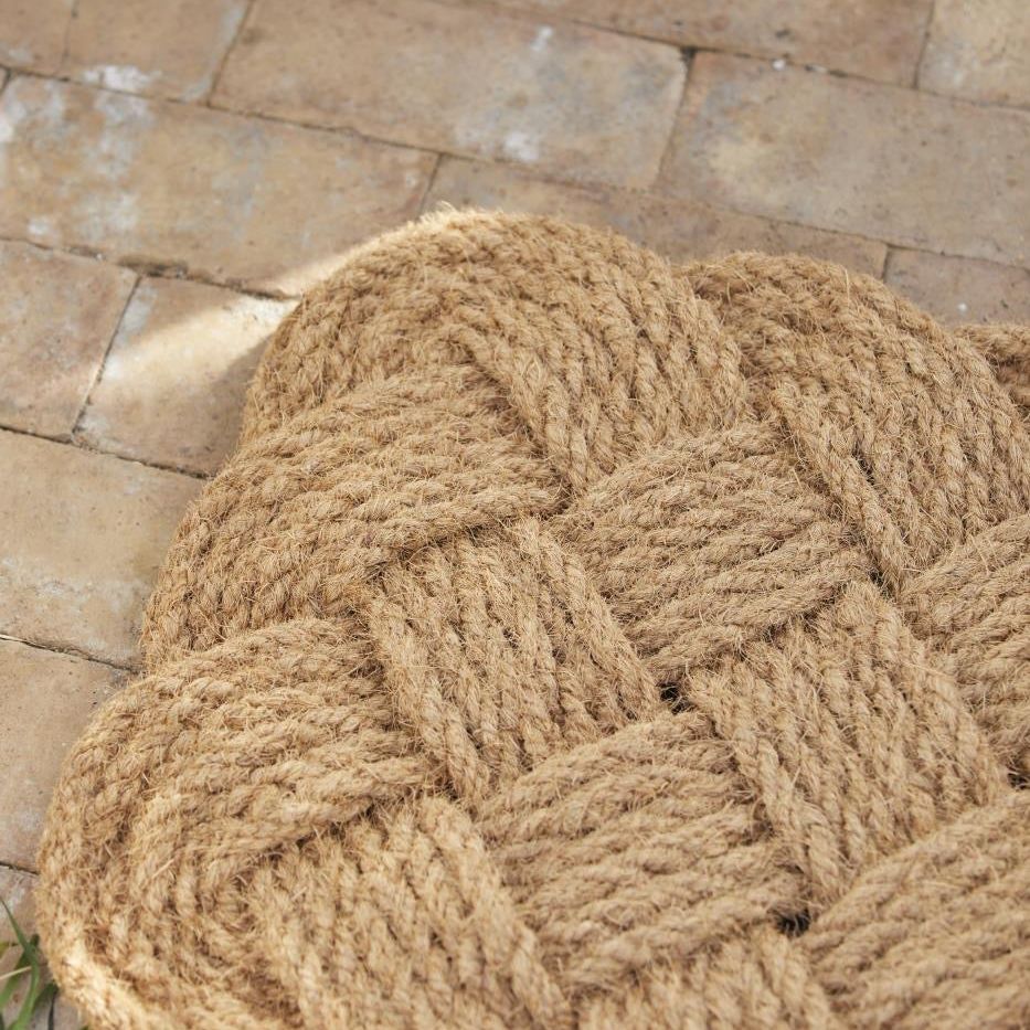 Rectangular braided coconut fibre doormat perfectly woven for a warm, inviting hallway. Use both indoors and outdoors