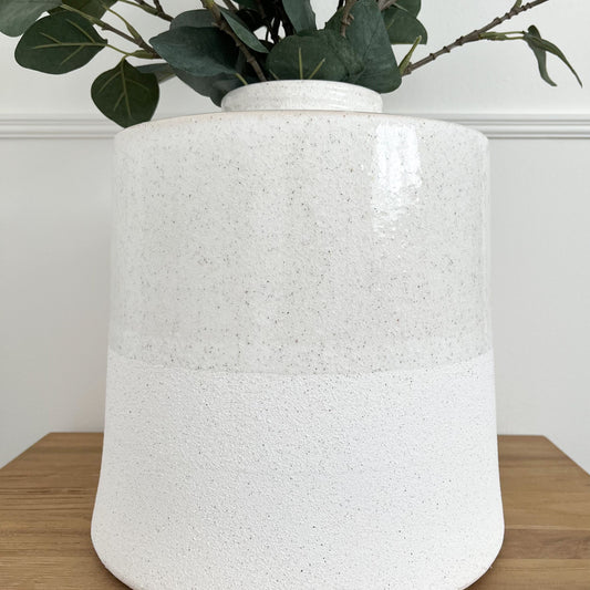 two-tone extra large white ceramic vase with bottle neck. Half glazed and half textured base.