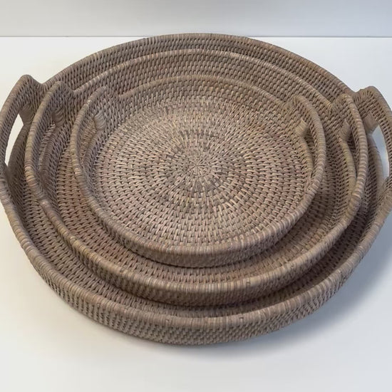 video closeup of white wash rattan round trays