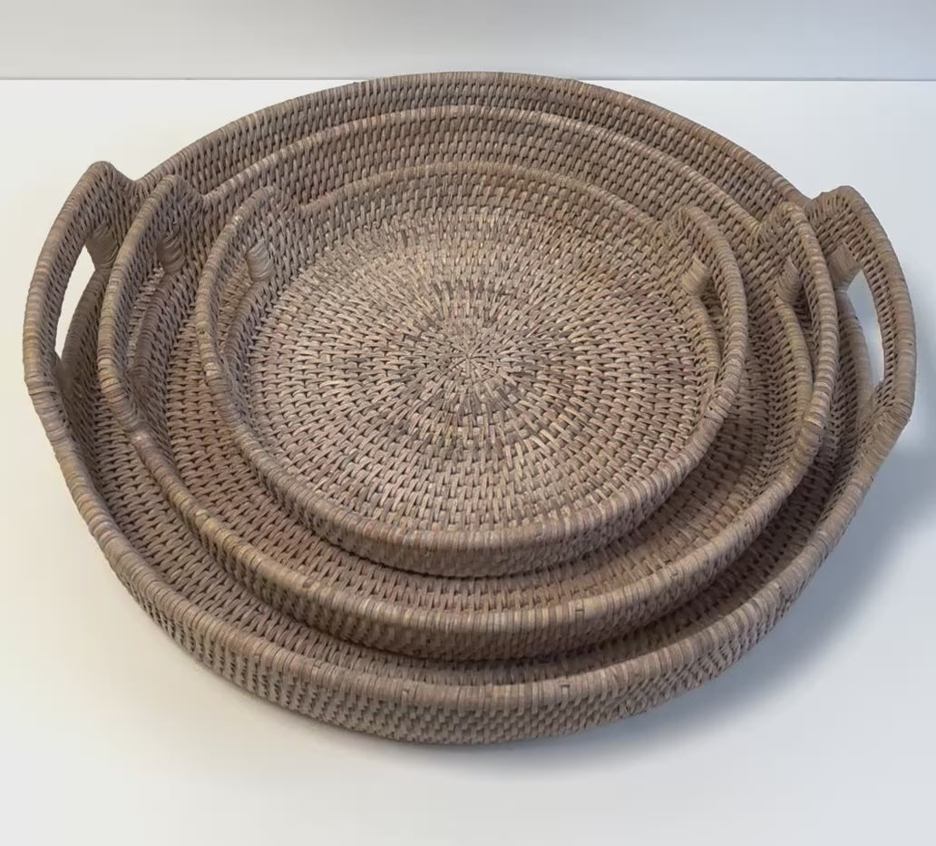 video closeup of white wash rattan round trays