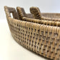 Woven rattan tray on a white background