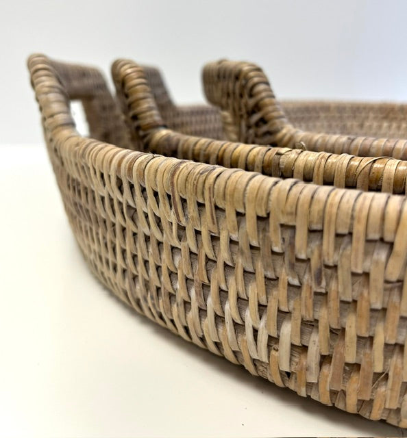 Woven rattan tray on a white background
