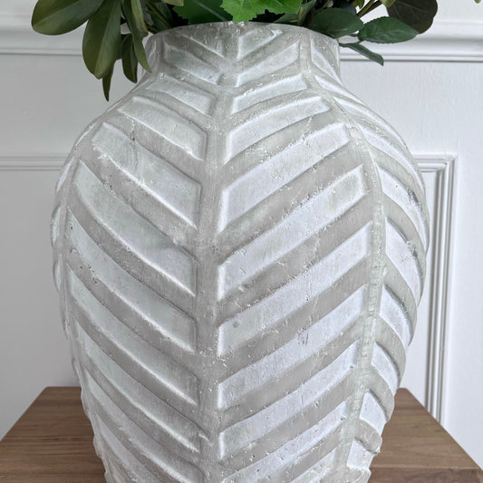 extra large herringbone detailed white vase, holding an arrangement of flowers