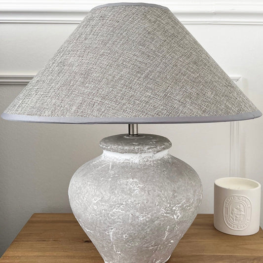 white washed stone effect lamp base with dark grey shade