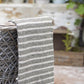 striped grey and cream throw with fringed edges