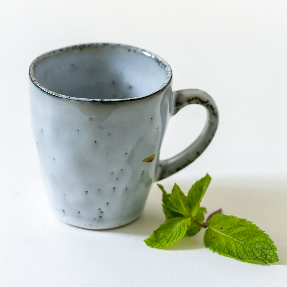 ceramic rustic-looking blue/grey mug with handle