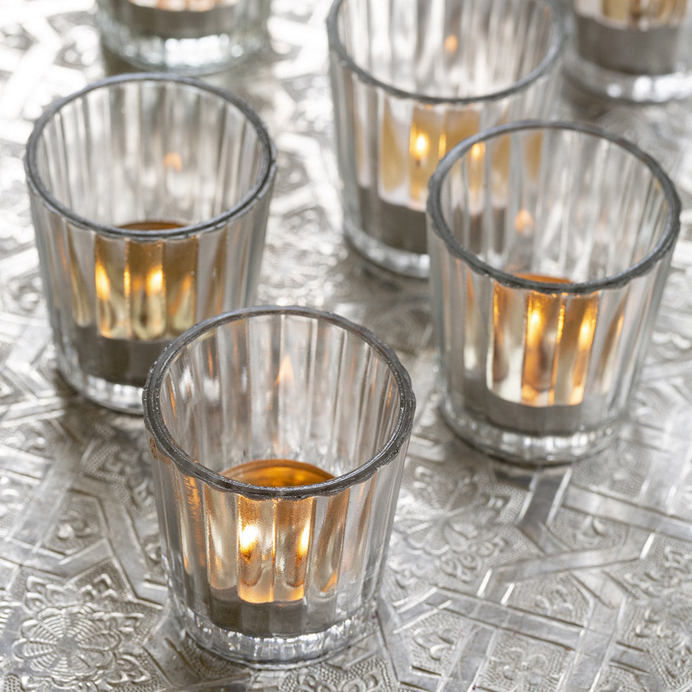 close up of clear ribbed glass votive holders
