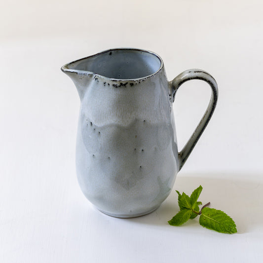 ceramic rustic-looking blue/grey jug with handle