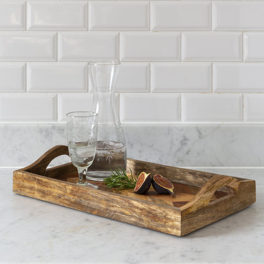 acacia and mango wood serving tray with handles and chevron base